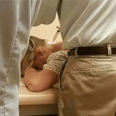 DeAnn on a medical exam table